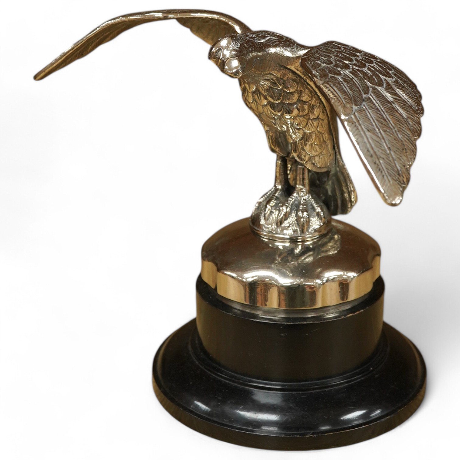 A large chromed eagle car mascot, mounted on a large radiator cap and turned socle, height 21.5cm. Condition - good.